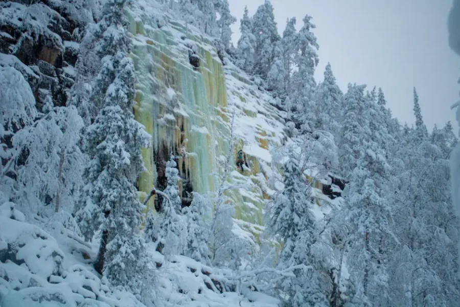 Professional ice climbing on Korouoma frozen waterfall