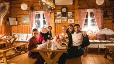 Guests enjoying an authentic reindeer farm experience in Lapland