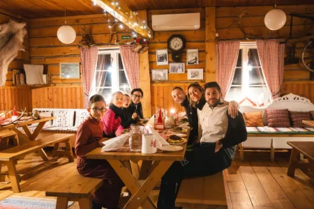Guests enjoying an authentic reindeer farm experience in Lapland